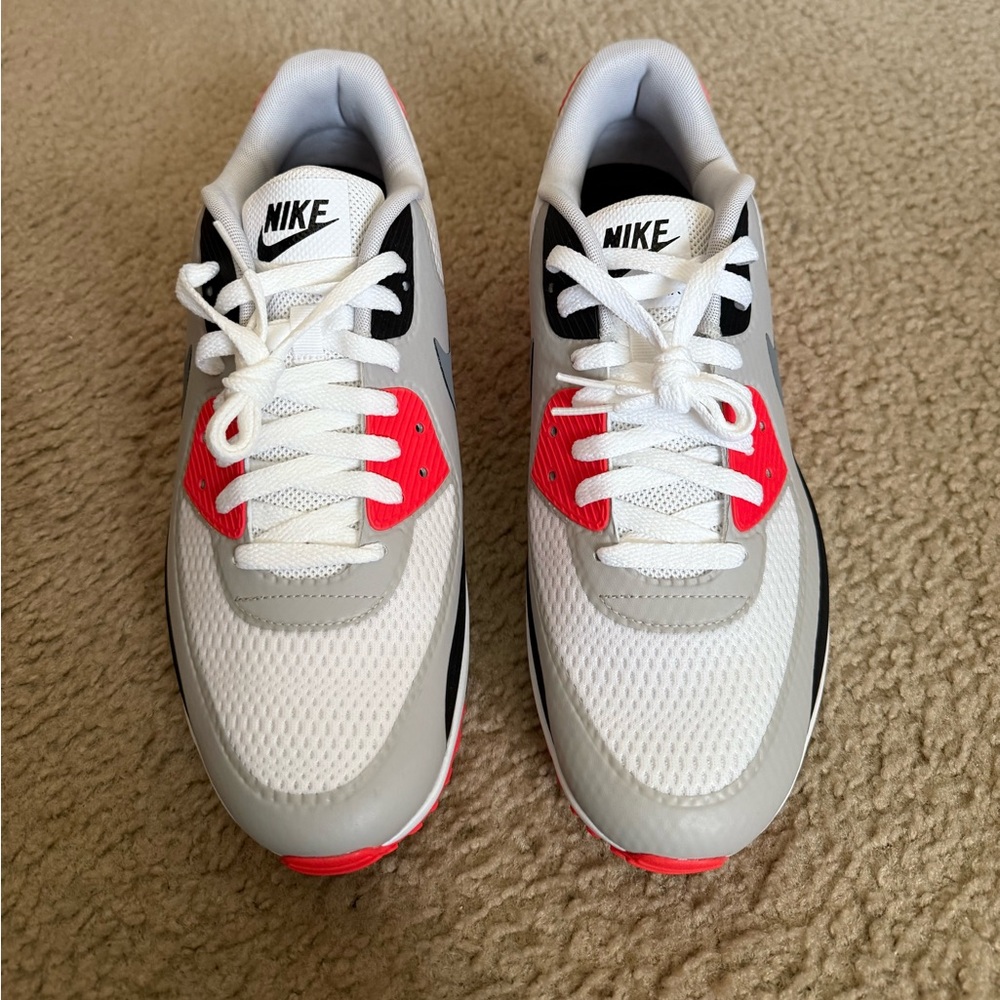 Brand New Nike Air Max.  Black, white and orange.